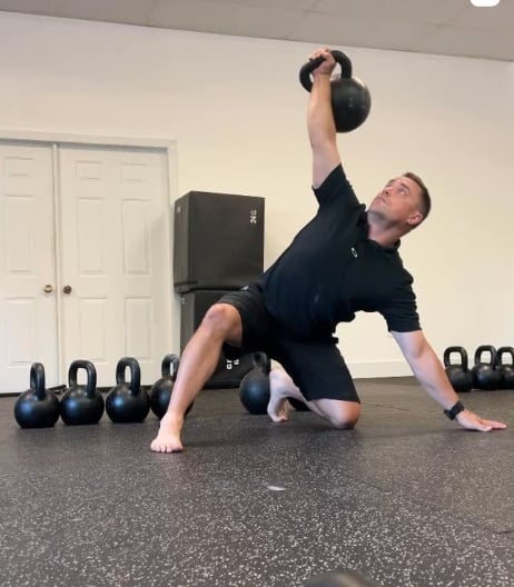 colin demonstrating a kettlebell lift