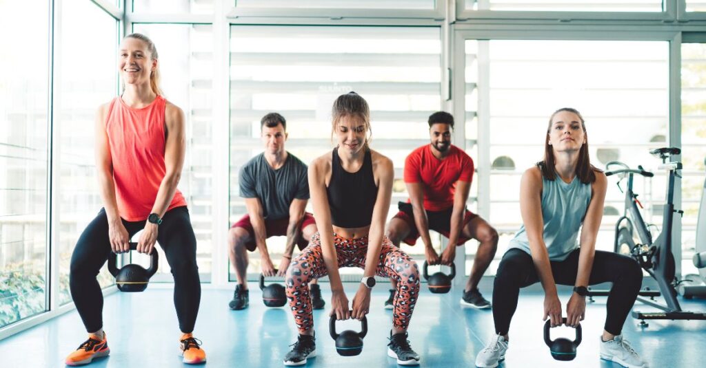 people enjoying a kettlebell class together